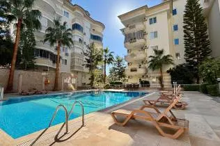 Spacious furnished apartment with a pool and city views in Cikcilli, Alanya